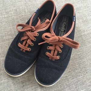 Black and brown Keds